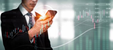 Businessman analyst working with digital finance business data graph showing technology of investment strategy for perceptive financial business decision. Digital economic analysis technology concept.