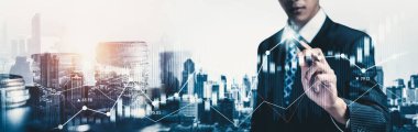 Businessman analyst working with digital finance business data graph showing technology of investment strategy for perceptive financial business decision. Digital economic analysis technology concept.
