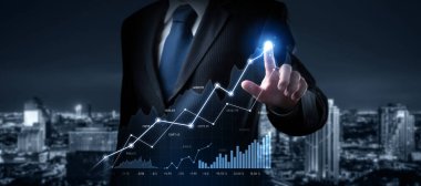 Businessman analyst working with digital finance business data graph showing technology of investment strategy for perceptive financial business decision. Digital economic analysis technology concept.