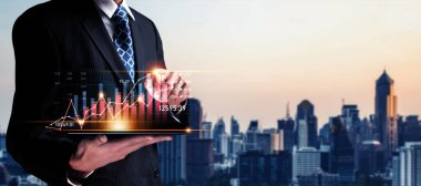 Businessman analyst working with digital finance business data graph showing technology of investment strategy for perceptive financial business decision. Digital economic analysis technology concept.