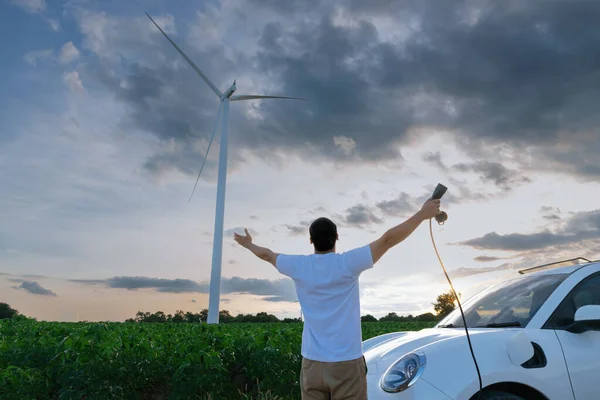 Progressive Man Spread Arm Electric Car Recharge Energy Charging Station — Fotografia de Stock