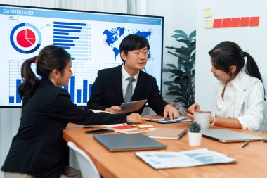 Business team of financial data analysis meeting with business intelligence, report paper and dashboard on laptop for marketing strategy. Business people working together to promote harmony in office.