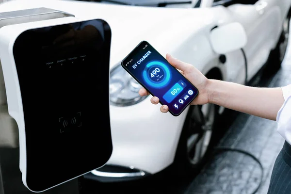 Battery Status Electric Vehicle Displayed Smartphone Application Software While Vehicle — стоковое фото