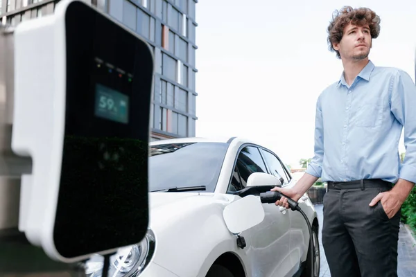 Progressive Businessman Insert Charger Plug Charging Station His Electric Vehicle — Φωτογραφία Αρχείου