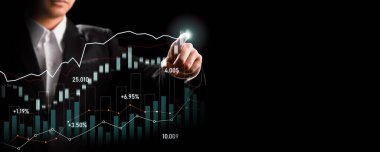 Businessman analyst working with digital finance business data graph showing technology of investment strategy for perceptive financial business decision. Digital economic analysis technology concept.