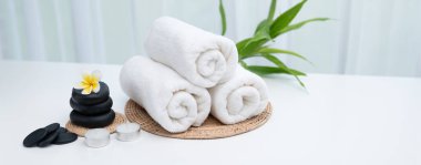 Spa accessory composition set in day spa hotel , beauty wellness center . Spa product are placed in luxury spa resort room , ready for massage therapy from professional service .