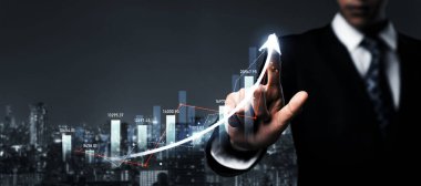 Businessman analyst working with digital finance business data graph showing technology of investment strategy for perceptive financial business decision. Digital economic analysis technology concept.