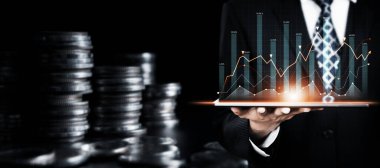 Businessman analyst working with digital finance business data graph showing technology of investment strategy for perceptive financial business decision. Digital economic analysis technology concept.