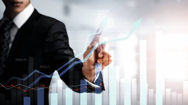 Businessman analyst working with digital finance business data graph showing technology of investment strategy for perceptive financial business decision. Digital economic analysis technology concept.