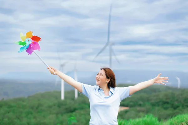 Concept Progressive Happy Woman Relaxing Wind Turbine Farm Windmill Toy — Fotografia de Stock