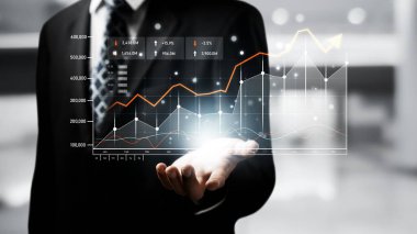 Businessman analyst working with digital finance business data graph showing technology of investment strategy for perceptive financial business decision. Digital economic analysis technology concept.