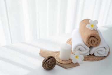 Spa accessory composition set in day spa hotel , beauty wellness center . Spa product are placed in luxury spa resort room , ready for massage therapy from professional service .