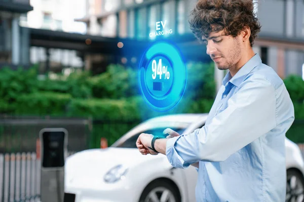 Progressive Businessman Check Wearable Hologram Watch Electric Car Battery Being — Stok fotoğraf