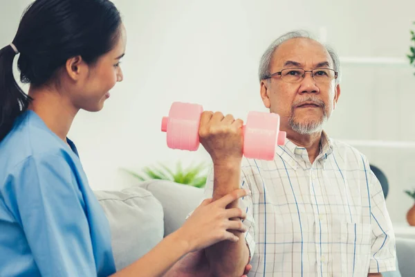 Unyielding Senior Patient Doing Physical Therapy Help His Caregiver Senior — Foto Stock