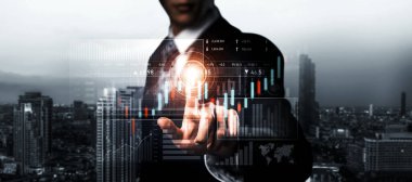 Businessman analyst working with digital finance business data graph showing technology of investment strategy for perceptive financial business decision. Digital economic analysis technology concept.