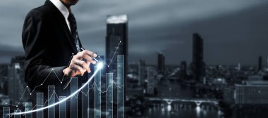 Businessman analyst working with digital finance business data graph showing technology of investment strategy for perceptive financial business decision. Digital economic analysis technology concept.