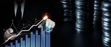 Businessman analyst working with digital finance business data graph showing technology of investment strategy for perceptive financial business decision. Digital economic analysis technology concept.