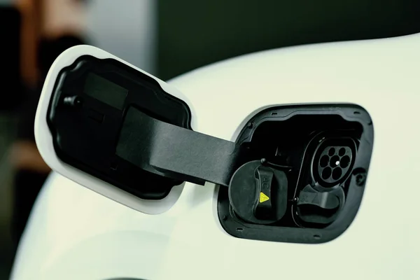 Closeup Electric Vehicle Plugged Cable Charging Point Powered Progressive Concept — Zdjęcie stockowe