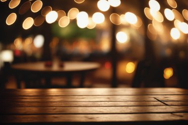 Empty wood table for product display in blur background of admirable restaurant at night