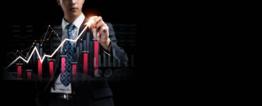 Businessman analyst working with digital finance business data graph showing technology of investment strategy for perceptive financial business decision. Digital economic analysis technology concept.