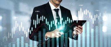 Businessman analyst working with digital finance business data graph showing technology of investment strategy for perceptive financial business decision. Digital economic analysis technology concept.