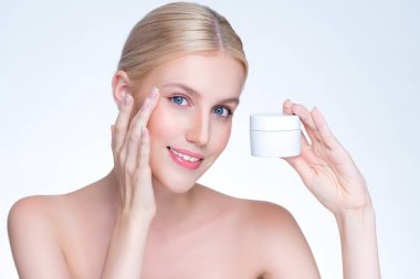 Personable beautiful perfect natural skin woman hold mockup jar moisturizer cream for skincare treatment product advertisement in isolated background with expressive facial and gesture expression.