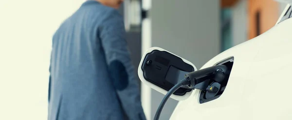 Focus Electric Car Charging Home Charging Station Blurred Progressive Man — стоковое фото