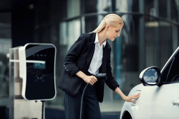 Progressive Businesswoman Insert Charger Plug Charging Station Her Electric Vehicle — Stock fotografie