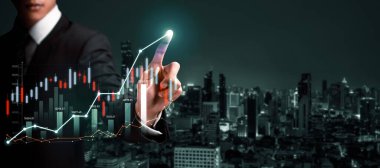 Businessman analyst working with digital finance business data graph showing technology of investment strategy for perceptive financial business decision. Digital economic analysis technology concept.