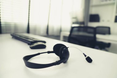 Close up image of headphones for competent online working. Customer service operator equipments.