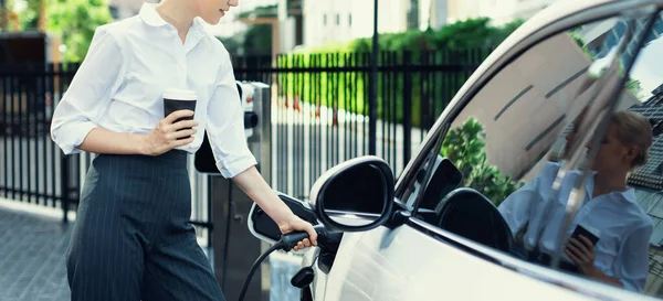 Closeup Businesswoman Holding Coffee Insert Charger Electric Vehicle Public Charging — Stok fotoğraf