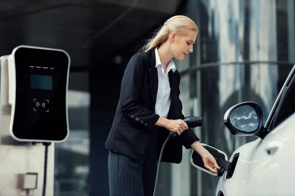 Progressive Businesswoman Insert Charger Plug Charging Station Her Electric Vehicle — Stok fotoğraf