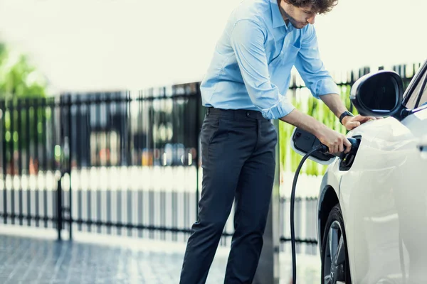 Progressive Businessman Insert Charger Plug Charging Station His Electric Vehicle — Fotografia de Stock