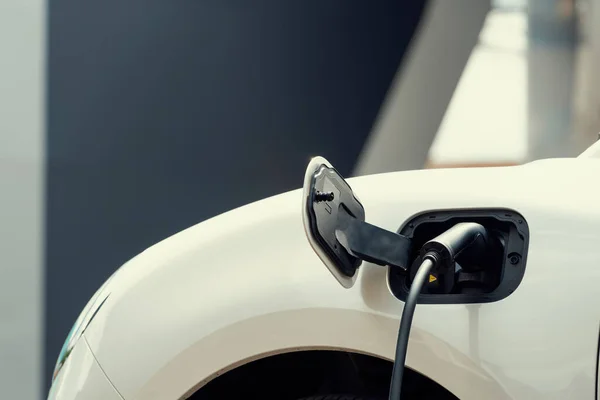 Closeup Electric Vehicle Plugged Cable Charging Point Powered Progressive Concept —  Fotos de Stock