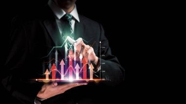 Businessman analyst working with digital finance business data graph showing technology of investment strategy for perceptive financial business decision. Digital economic analysis technology concept.