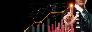 Businessman analyst working with digital finance business data graph showing technology of investment strategy for perceptive financial business decision. Digital economic analysis technology concept.