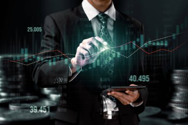 Businessman analyst working with digital finance business data graph showing technology of investment strategy for perceptive financial business decision. Digital economic analysis technology concept.