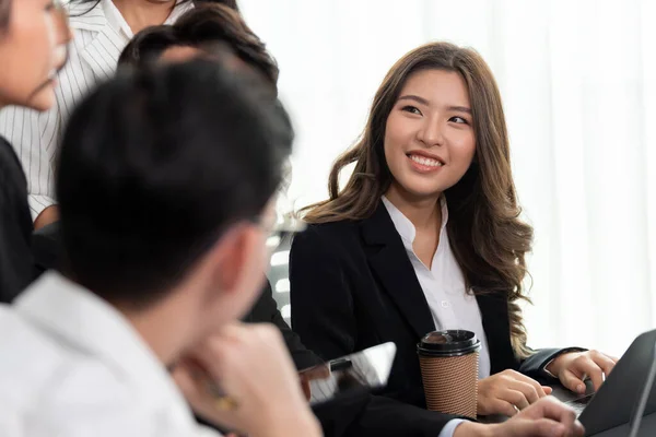 stock image Focus portrait of female manger, businesswoman in the harmony meeting room with blurred of colleagues working together, analyzing financial paper report and dashboard data in background.