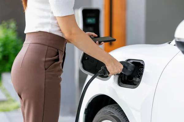 Closeup Progressive Woman Install Cable Plug Her Electric Car Home — Stock Photo, Image
