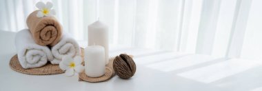 Spa accessory composition set in day spa hotel , beauty wellness center . Spa product are placed in luxury spa resort room , ready for massage therapy from professional service .