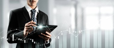 Businessman analyst working with digital finance business data graph showing technology of investment strategy for perceptive financial business decision. Digital economic analysis technology concept.