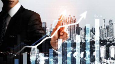 Businessman analyst working with digital finance business data graph showing technology of investment strategy for perceptive financial business decision. Digital economic analysis technology concept.