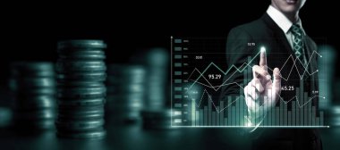 Businessman analyst working with digital finance business data graph showing technology of investment strategy for perceptive financial business decision. Digital economic analysis technology concept.