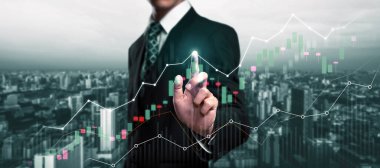 Businessman analyst working with digital finance business data graph showing technology of investment strategy for perceptive financial business decision. Digital economic analysis technology concept.