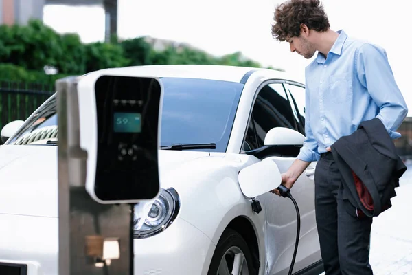 Progressive Businessman Insert Charger Plug Charging Station His Electric Vehicle — Fotografia de Stock