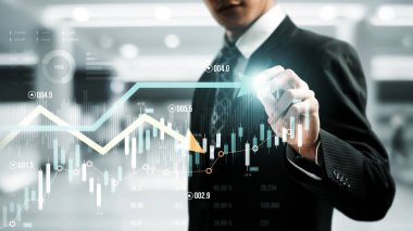 Businessman analyst working with digital finance business data graph showing technology of investment strategy for perceptive financial business decision. Digital economic analysis technology concept.