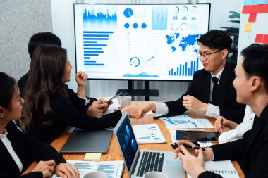 Businesspeople shake hand after successful agreement or meeting. Office worker colleague handshake with business team leader manager for strong teamwork in office to promote harmony and unity concept.