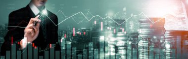 Businessman analyst working with digital finance business data graph showing technology of investment strategy for perceptive financial business decision. Digital economic analysis technology concept.