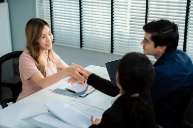 A new and competent female employee successfully interviewed. Newly graduated gets her first job after the interview.