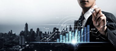 Businessman analyst working with digital finance business data graph showing technology of investment strategy for perceptive financial business decision. Digital economic analysis technology concept.
